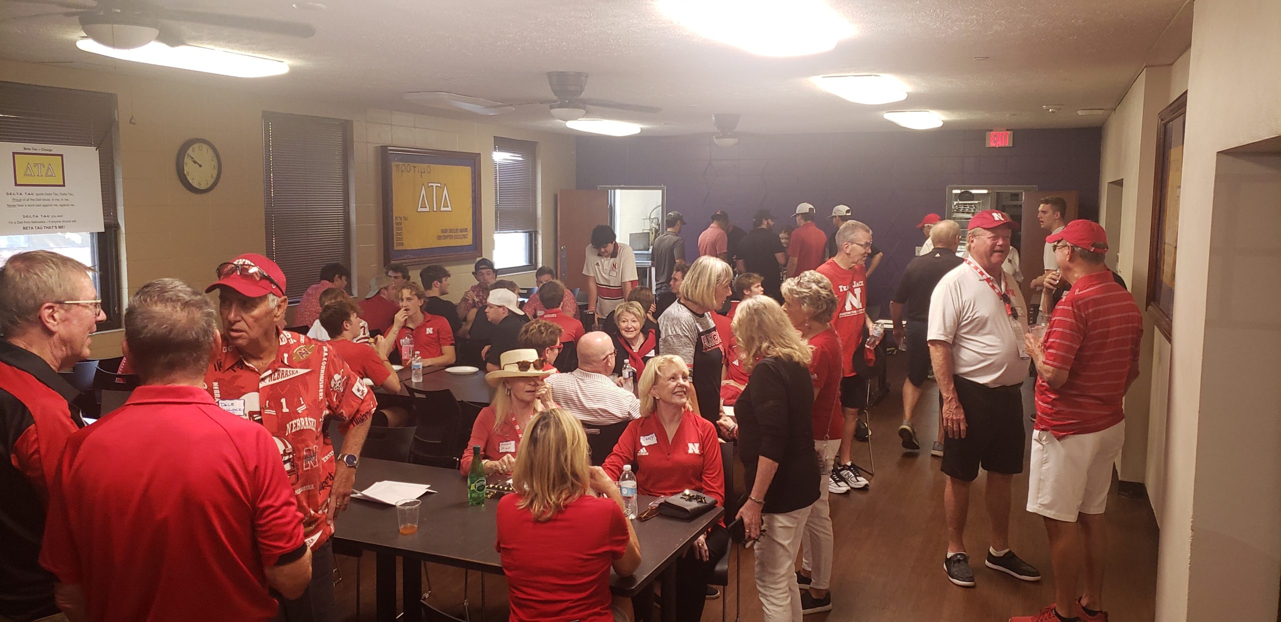 The dining room of the Beta Tau Delta Shelter was packed with undergraduates, alumni, and guests at the 2023 Alumni Tailgate.
